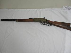 lot 69 image: Winchester M1873 Engraved Lever Action Replica Rifle - Gold Tone,  Movie Prop Gun, Wall Hanger