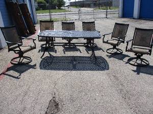 lot 3 image: 7-Piece Outdoor Dining Set. Metal Table and 6- Swival  Rocker Arm Chairs