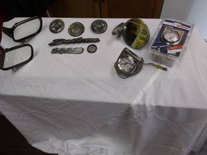 lot 118 image: Lot Of Car Emblems, Mirrors, And Gauges
