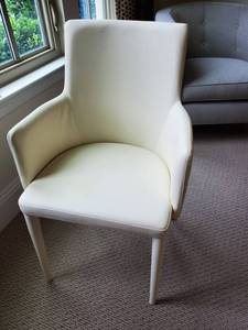 lot 61 image: Safavieh Mid-Century Summerset Buttercream Faux Leather Chair