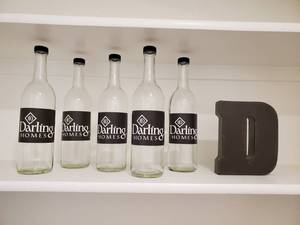 lot 169 image: 5 Screw Top Darling Labeled Glass Bottles &amp Metal D