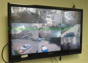 lot 19 image: Complete security system includes 2 - 39 flat screen TV monitors, cameras, and control box. Still installed, buyer must remove.