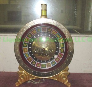 lot 64 image: Roulette wheel slot machine illuminated topper