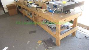 lot 156 image: Heavy duty custom built low rise display table, contents not included