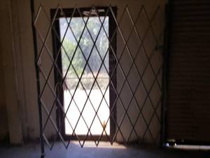 lot 257 image: Accordian style security gate