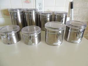 lot 23 image: Stainless canister sets (2 sets of 4)  - 4, 5, 7, and 8 height