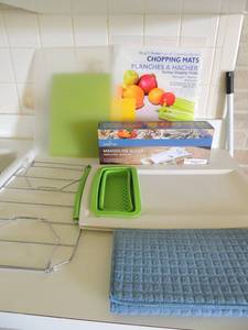 lot 34 image: Crofton manual slicer NIB cutting board, cutting mats and drying mat