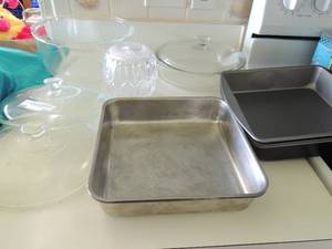 lot 35 image: Glass mixing bowl, covered casserole 2 glass lids, glass dessert bowl 8x8 metal baking pan x 5