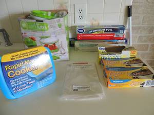 lot 37 image: Cook 13 piece super slicer, foil, cooker liners, parchment paper and rapid mac cooker new