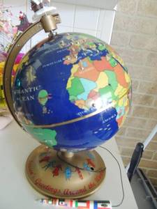 lot 53 image: Mr. Christmas. Speaks Merry Christmas  in 22 languages  when you touch the country with pen