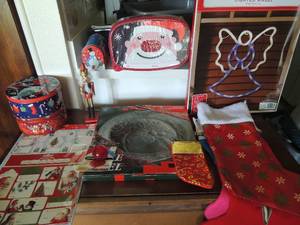 lot 79 image: Blue tote full of Christmas dcor, stockings, tags, tins, glass, platter, ribbon and more