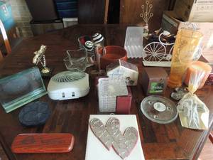 lot 81 image: Misc. home dcor- heart and star shaped glass candy dishes wooden nut bowl, metal bike tire gauge. Candles, crosses and more