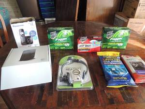 lot 84 image: Panasonic Cordless Bluetooth home phone, AT&T microcell by cisco Hot shot joggers x 2 new Collet ear buds, wipes and ant bait new in box