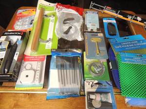 lot 92 image: Rubber patch kit, Pocket tape measure, Patio door handle, Universal 3 key sunglass cord and pot holders