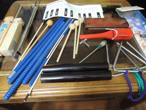 lot 93 image: Drum sticks, keyboard chart, 2 train whistles, triangles and more.
