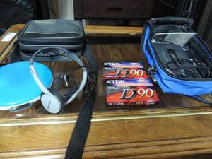 lot 103 image: Memorex portable CD player with head phones, new in case, cassette player new in case with 2 blank tapes