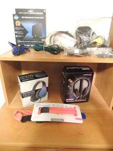 lot 114 image: Clear TV modem in box used, Vivitar sports belt new, assorted phone cords and chargers, coax cables, flathead folding headphones new