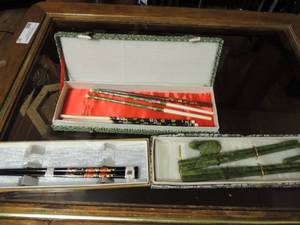 lot 127 image: 3 boxes of new chop sticks, 1 set in black and white box is marble green with 2 mini frogs 1 tip is broken