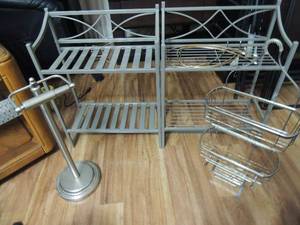 lot 128 image: 2 metal bathroom towel shelves 2 shelves on each, toilet paper roll holder, shower bath wash organizer