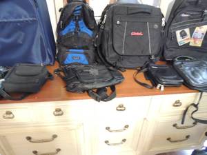 lot 133 image: Various black leather fanny pack, small purses, lucas gear back pack new, Glotel black schoolbook