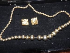 lot 244 image: Gold graduated bead 28 necklace and a pair of gold clip on earring
