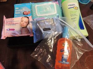 lot 238 image: Facial wipes, cleaning cloths, aloe baby lotion, open banana boat 30 SPF sunblock