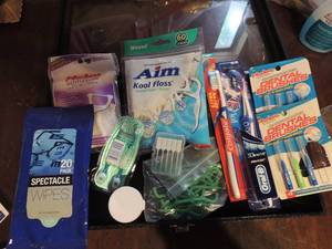 lot 237 image: Teeth and eye lot- tooth brush x 2 NIP, Dental brushes x 2 one open, AIM kool floss Gentelglide, eye glass wipes and anti fog.