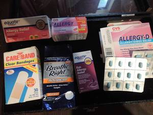 lot 236 image: Band aids, allergy tablets  x 2 and 1 open box, eye allergy relief drops and breath right pack
