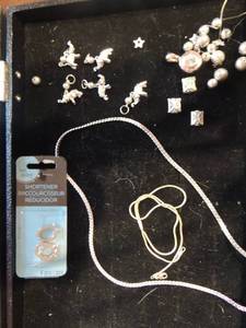 lot 228 image: Charms 5 elephants,  3 packages silver chain   gold chain   necklace shorter and gold pendant with crystal