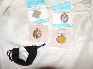 lot 224 image: Fashion accessories- necklace pendants square teal oval gold and silverAnnax gold tree round with oval yellow crystal and oblong white shell total of 5