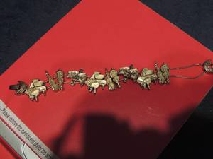 lot 210 image: 7 bracelet with violin, piano, and musical notes