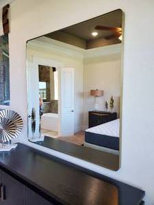lot 299 image: Rounded Metal Framed Square Mirror
