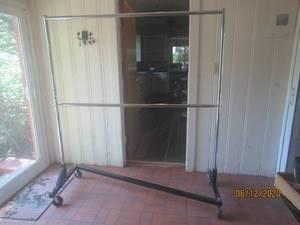lot 111 image: ROLLING GARMENT RACK WITH LOCKING WHEELS