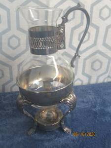 lot 432 image: 13 H CORNING HEAT PROOF GLASS CARAFE&nbsp WITH SILVER WARMER STAND