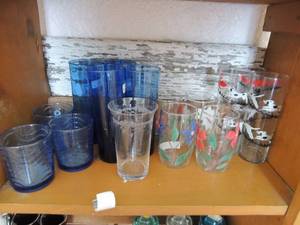 lot 33 image: 2 tall dog decor drinking glasses, 5 blue and red floral glasses, 4 tall blue glasses, 2 small light blue Kig Indonesian glasses4