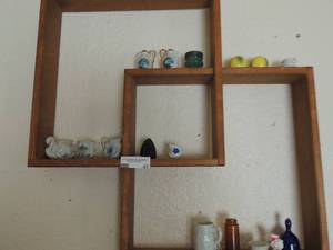 lot 42 image: Blue rose covered bell, vintage sweet creamer,smallbrown bottle, a pikes peak Colorado tiny tea cup, small Taiwan white bear with heart (glass)tiny flower water pot, plastic black iron, glass swan with blue x 2, Norcrest Colorado tea cup and more