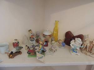 lot 97 image: Curio cabinet nick knacks-An VICTORIAN COUPLE, GARDEN PALS, S&P SHAKERS WOODEN DOGS AND MORE