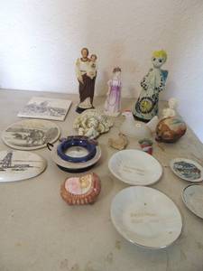 lot 116 image: Quebec tile oval cow tile, egg shaped wind mill, 4 small plates, Torala Mexico 319 angel wings are broken, Charades lady statue wearing purple dress Vintage saint Anthony statue and more