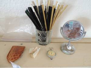 lot 134 image: Mini mirror stand small jar of paper straws and caf stirrers. Antique Nautica knifes comes with leather case made in west germany