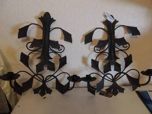 lot 142 image: pair of 19 x 16 metal wall candle holders. Each one holds 2 candles