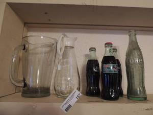 lot 157 image: Glass- tea pitcher, syrup pitcher and four 2002 Coke bottles