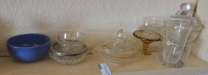 lot 228 image: Assorted glass kitchen dishes such as cups, covered candy, lemon juicer, and lots of bowls