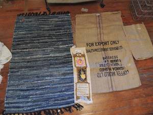 lot 271 image: Large BURLAP COFFEE BAG UGANA , Blue KNOTTED RUGMAT 51 X 31,   small brown potato bag, CLOCK TAPESTRY
