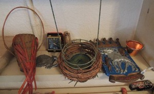 lot 285 image: Metal moose plaque,  Wicker hanging plant holder ,  Golf symbol and more