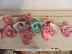lot 290 image: METAL Pink and green cola bottle openers x 9  some say Texas