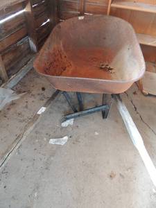 lot 319 image: wheel barrow has flat tire  - garden dcor