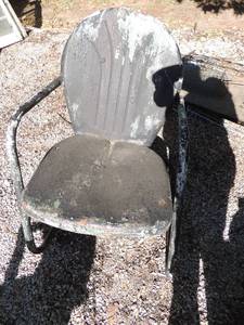 lot 335 image: Black metal yard chair needs repair at bottom