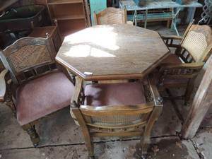 lot 341 image: Octagon shaped kitchen table with  4 rolling chairs ( ONE HAS A FRACTURE FOOT)