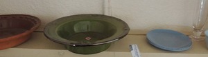 lot 381 image: Dallas ware dip bowl blue and saucers all plastic,  2 pink depression ware glasses,   brown gourmet top pie plate     green bowl