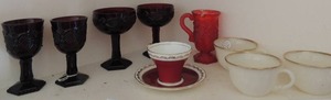 lot 415 image: 4 dark red glasses   1 bright red glass 3 fire king glasses    Aynsley red cup and saucer